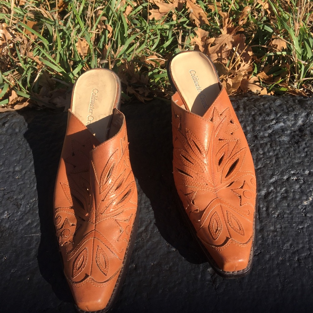 ColdWater Creek tan leather mules with cutouts.